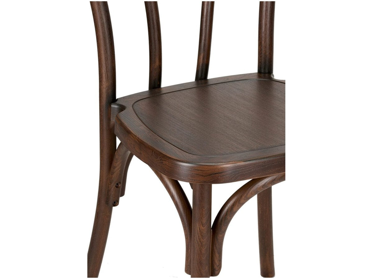 The fruitwood resin Bentwood. The curve of the back is molded, not steam-bent — which is why weather does not affect it.